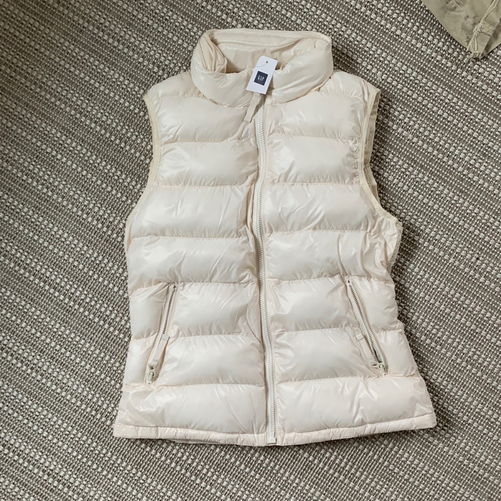 vest. color- off white. never worn. new with tags